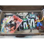 A vintage suitcase containing toys, annuals etc.