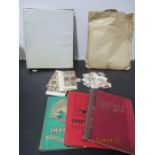 Four stamp albums with a quantity of loose stamps