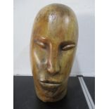 A carved wooden head approx 41 cm height