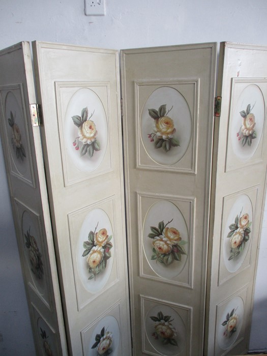 A hand painted four fold screen decorated with flowers