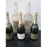 Three empty display bottles of Champagne ( Bollinger and Louis Roederer) along with two large