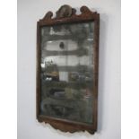 A Regency wall mirror with distressed original glass