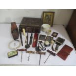 A collection of miscellaneous items including wood planer, corkscrews, vintage Colmans mustard