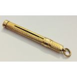 A 9ct gold propelling tooth pick. Weight 3.5g