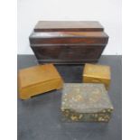 A mahogany tea caddy with brass stringing along with three other boxes