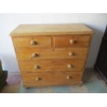 A pine chest of five drawers