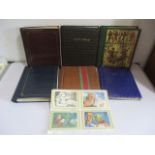 A collection of various stamp and postcards albums