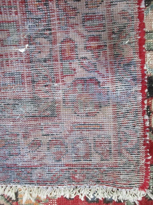 A red ground rug - Image 5 of 5