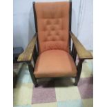 An Art & Crafts adjustable armchair with oak frame and button back upholstery, SB (?) stamped to