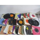 A collection of 7" single records including The Beatles