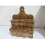 An antique elm spoon rack