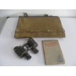 An artillery officers map bag, Bino Prism MK II with broad arrow stamp binoculars and Private Breger