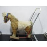 A Lines Bros. vintage plush pushalong horse with lift up saddle