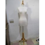 A tailors dummy on tripod stand