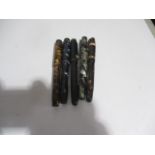 A selection of five fountain pens including Cadet, Kingswood etc