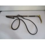 A horn handled riding whip with SCM mounts