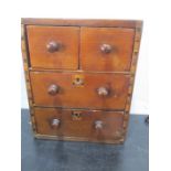 A miniature/ apprentice inlaid chest of four drawers