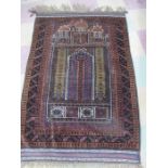 A red ground hand woven prayer rug