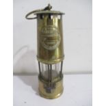 A brass miners lamp 'The Protector'