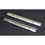 A hallmarked silver pencil case and scissor case.