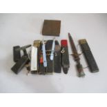 A collection of cut throat razors, knife, metal box etc