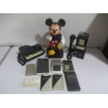 Three novelty telephones including Mickey Mouse etc, with eight assorted calculators