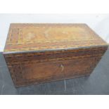 A Victorian inlaid tea caddy