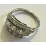An 18ct white gold Art Deco ring set with 3 rows of diamonds (17 in total)