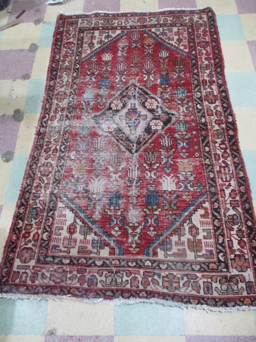 A red ground rug