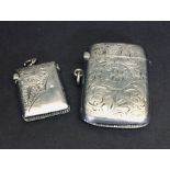 A hallmarked silver vesta case along with a smaller silver vesta