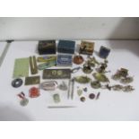 A collection of miscellaneous small interesting items including tins, brass, lighters etc