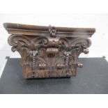 A heavily carved column top
