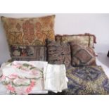 A collection of cushions and linen