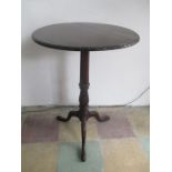 A mahogany occasional table on tripod base with fluted column and Acanthus leaf decoration and