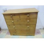 A pine chest of five drawers