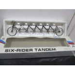 A die cast model of a six rider tandem bicycle