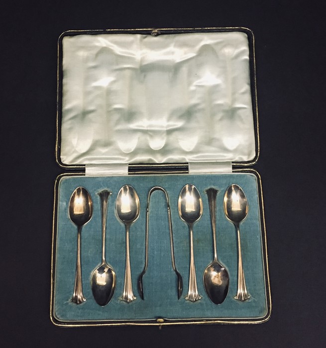 A cased set of hallmarked silver spoons and sugar tongs.