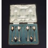 A cased set of hallmarked silver spoons and sugar tongs.