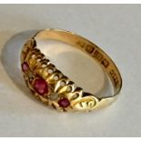 An 18ct gold ring with rubies and diamonds.