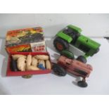 A collection of various toys including a Marx Cap Firing Tank, Rico tractor, Minic Tractor with