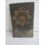 A vintage Devonshire Regiment metal sign