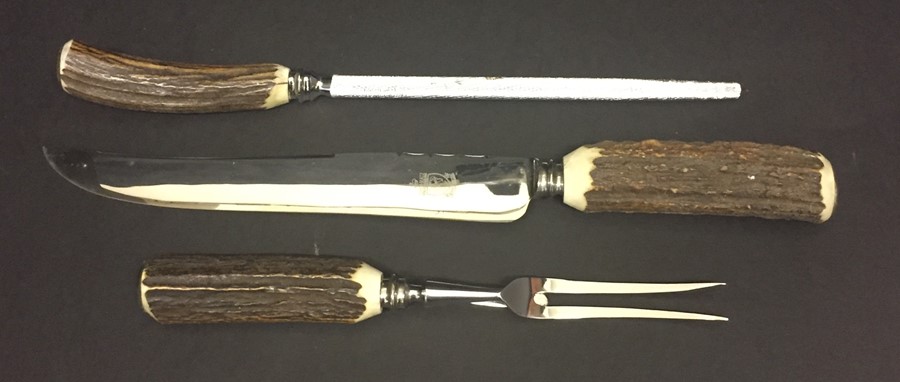 A collection of boxed hallmarked silver handled cutlery along with a horn handled carving set. - Image 2 of 2