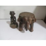An African fertility carving, along with an elephant four-footed stool