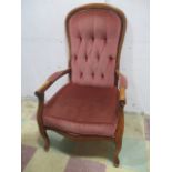 A Victorian style button backed arm chair