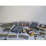A collection of Hornby and Tri-ang railway locomotives, carriages and buildings etc