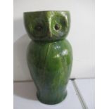 A green glazed pottery stick stand in the form of an owl- possibly Bretby, approx 52 cm height- beak