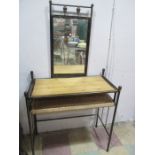 A metal dressing table with pine top
