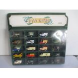 A Lledo Days Gone diecast display case with cars