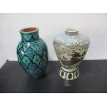 A Chinese vase decorated with a Kylin along with a Morrocan vase