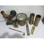 A collection of various items including a brass ice bucket, shell casing, cast iron cockerel door
